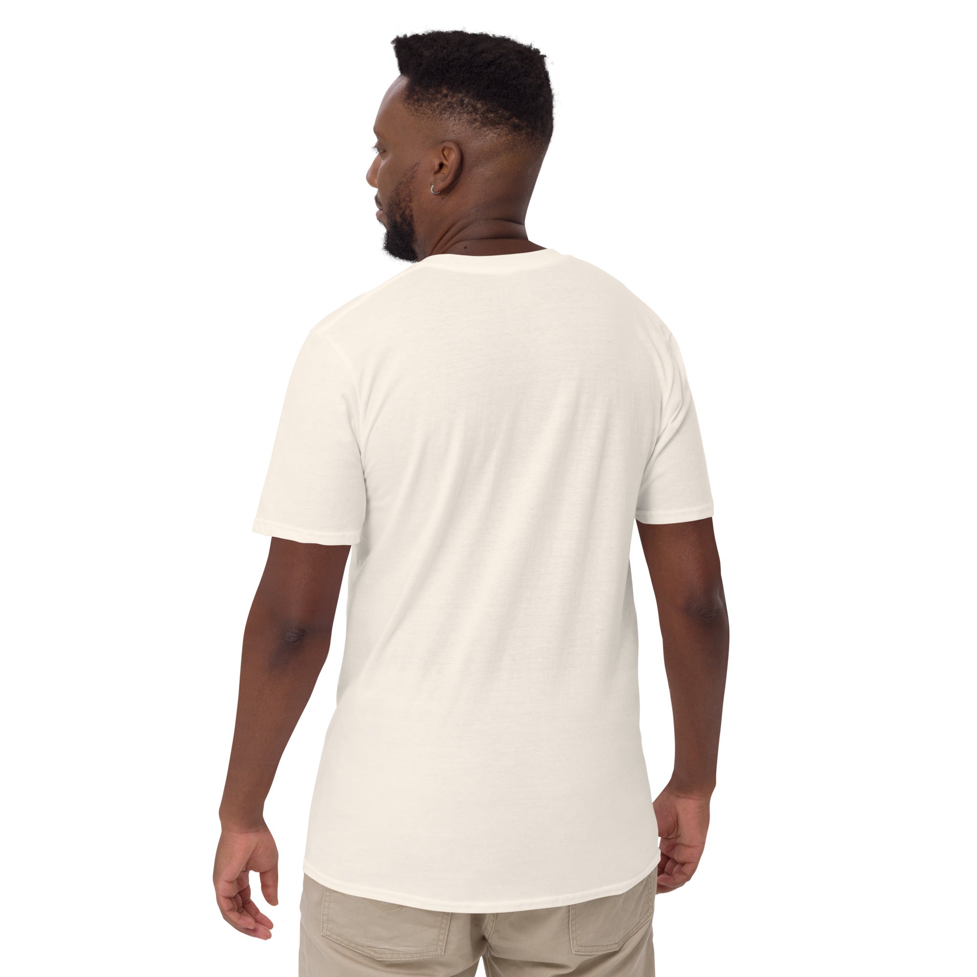 Back view of a man wearing the Frank Matthews Unisex T-Shirt in cream color, showcasing its relaxed fit.